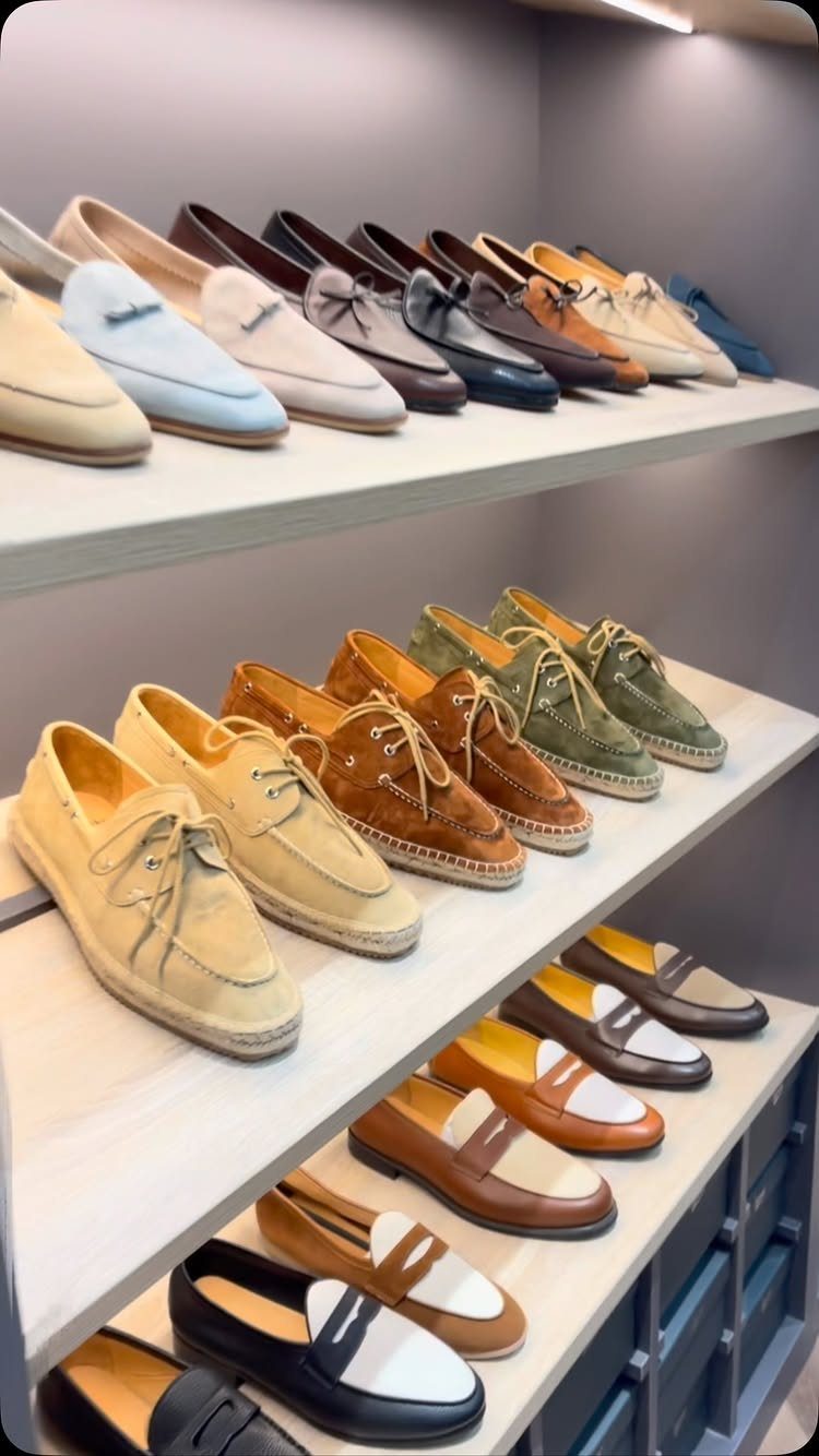 Canvas espadrille loafers in various colors displayed on a store shelf.